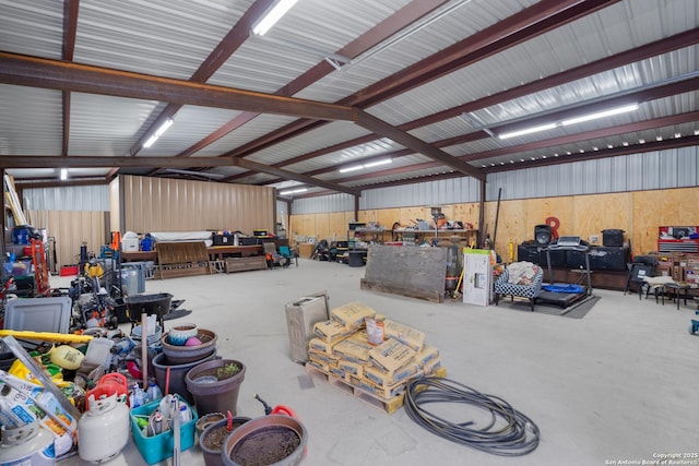 garage featuring metal wall and a workshop area