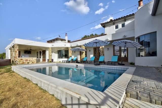 pool featuring a patio area and ceiling fan