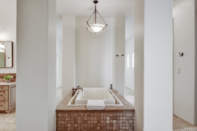 full bathroom featuring vanity and a bath