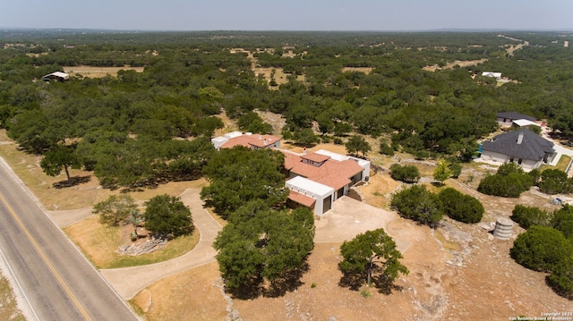 birds eye view of property with a wooded view