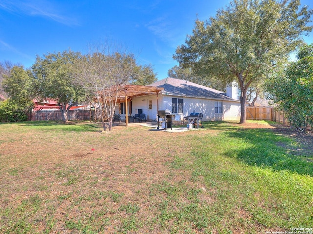 view of yard featuring a patio area and a fenced backyard