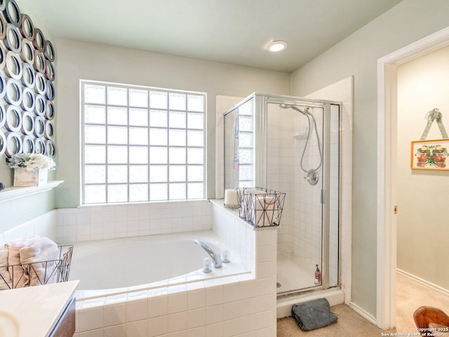 full bath featuring a stall shower, vanity, and a bath