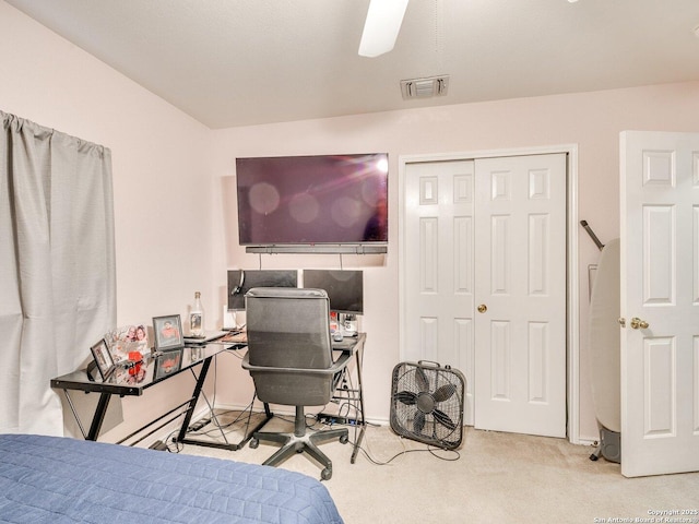 bedroom featuring carpet floors, a closet, visible vents, and a ceiling fan