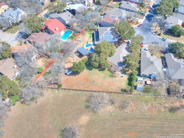 birds eye view of property with a residential view