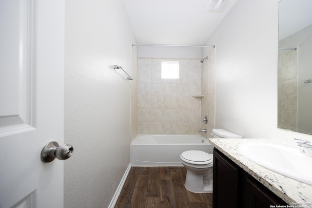 bathroom with shower / washtub combination, visible vents, toilet, vanity, and wood finished floors