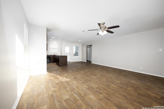 unfurnished living room with ceiling fan, baseboards, wood finished floors, and recessed lighting