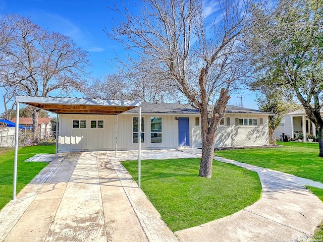 single story home featuring driveway, a front yard, and fence