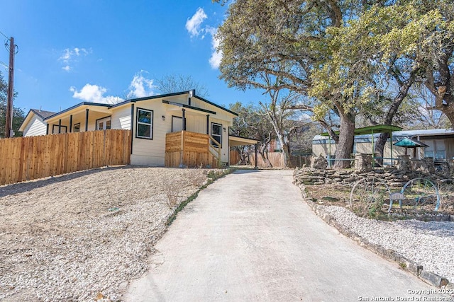 view of home's exterior featuring fence