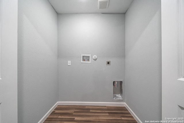 laundry room with baseboards, visible vents, dark wood-style flooring, hookup for a washing machine, and electric dryer hookup