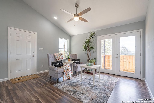 interior space featuring lofted ceiling, baseboards, wood finished floors, and french doors