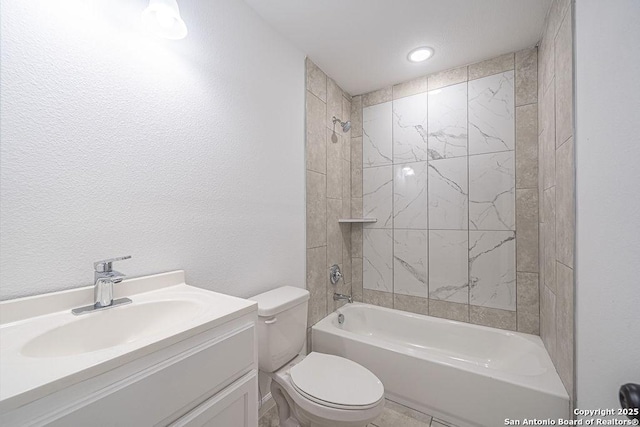 full bathroom with washtub / shower combination, a textured wall, vanity, and toilet