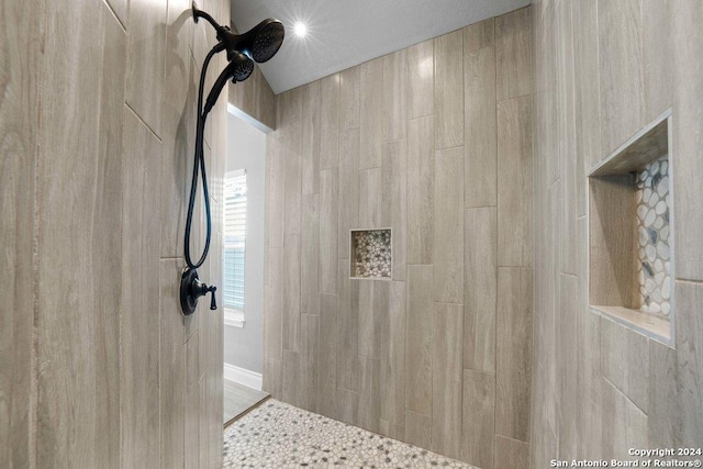 full bath featuring tiled shower