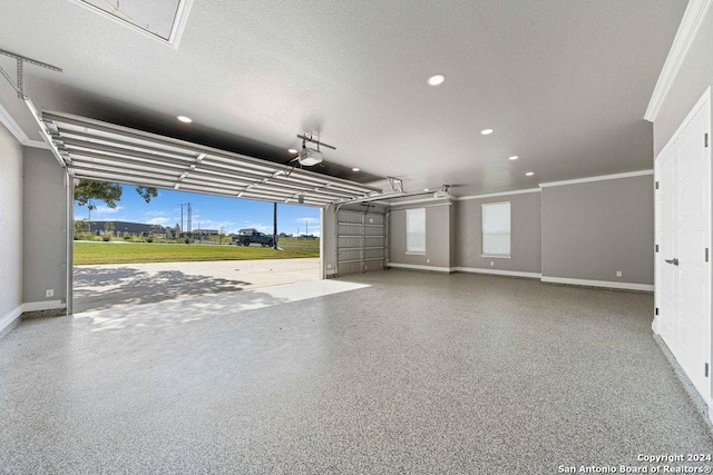 garage with a garage door opener, recessed lighting, and baseboards