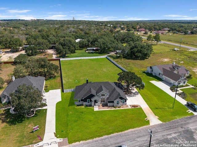 birds eye view of property with a forest view