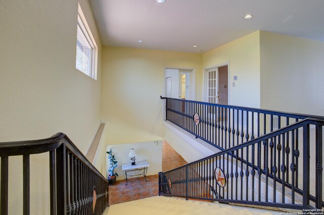 stairway featuring recessed lighting