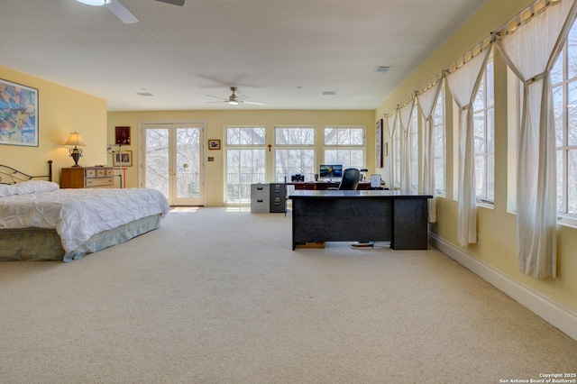 carpeted bedroom with visible vents, a ceiling fan, access to outside, french doors, and baseboards