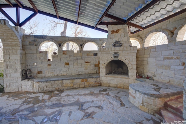 view of patio / terrace with an outdoor stone fireplace