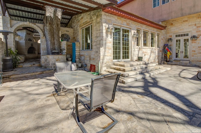 view of patio featuring french doors and outdoor dining area