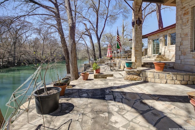 view of patio / terrace with a water view