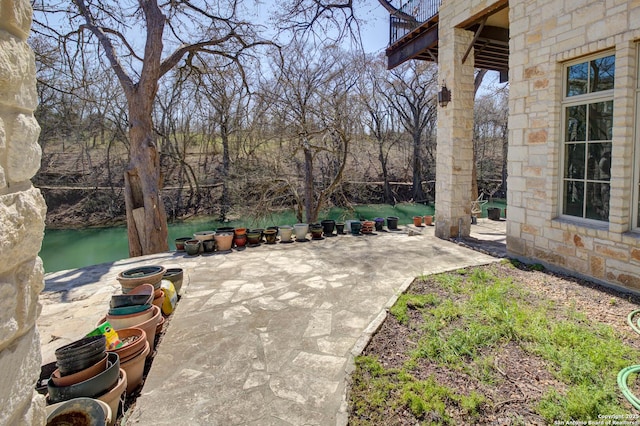 view of patio / terrace with a water view