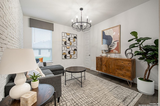 living area with a chandelier and wood finished floors