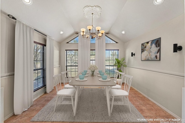 dining space with vaulted ceiling, light tile patterned floors, baseboards, and an inviting chandelier