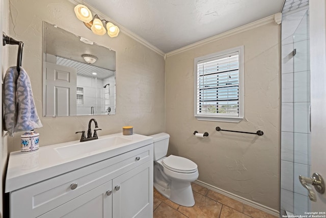 bathroom with crown molding, a textured wall, toilet, a tile shower, and vanity