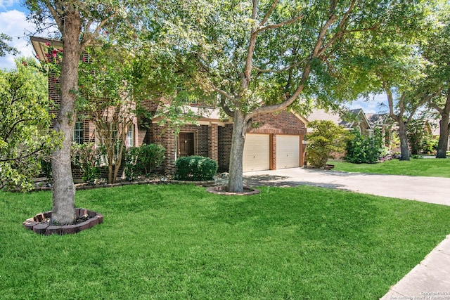 view of property hidden behind natural elements with a garage, a front yard, concrete driveway, and brick siding