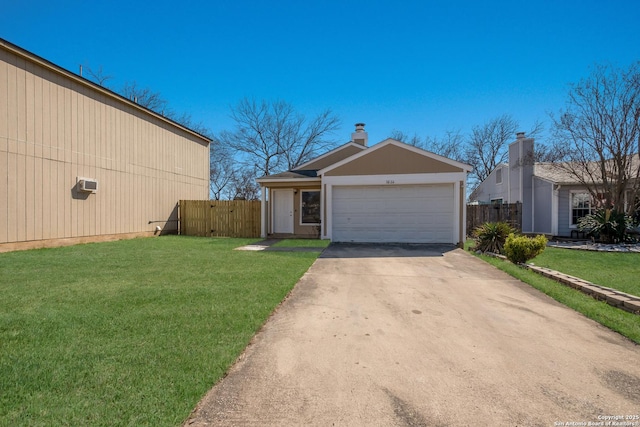 exterior space with fence, concrete driveway, and a front yard