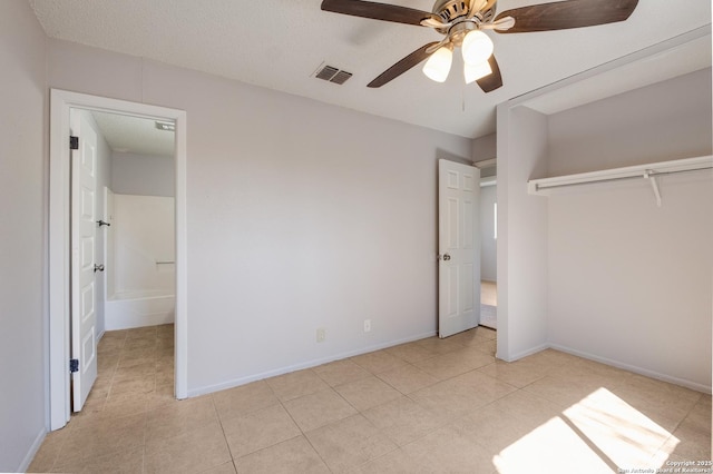 unfurnished bedroom with visible vents, baseboards, and light tile patterned flooring