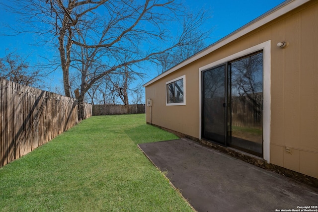 view of yard with a fenced backyard and a patio