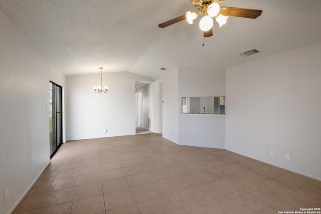 empty room with visible vents, tile patterned flooring, vaulted ceiling, a textured ceiling, and ceiling fan with notable chandelier