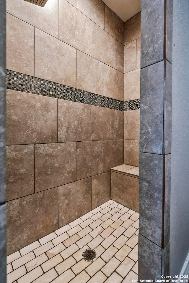 details with a tile shower