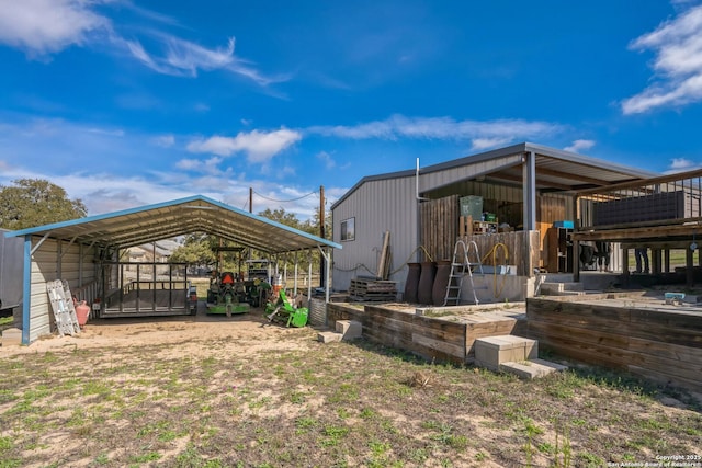 exterior space featuring driveway and a detached carport