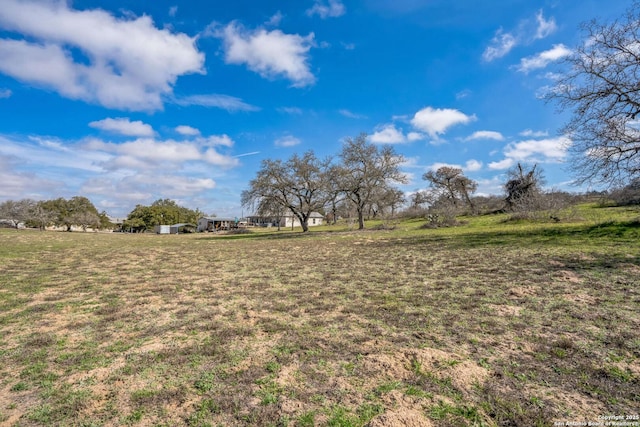 view of yard with a rural view