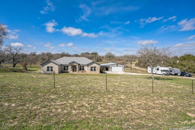 view of front of property with a front yard, driveway, and an attached garage