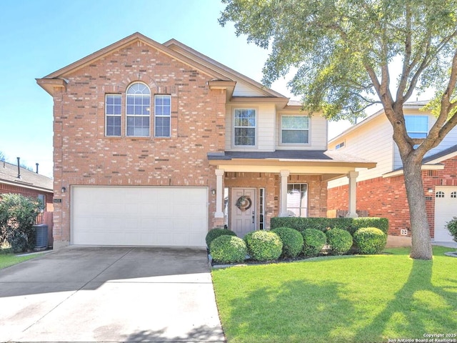 view of front of house with concrete driveway, brick siding, a front lawn, and an attached garage