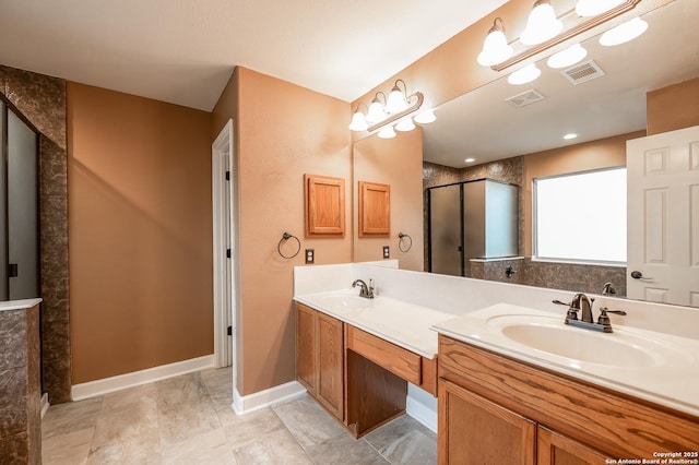 full bathroom with an enclosed shower, visible vents, a sink, and double vanity