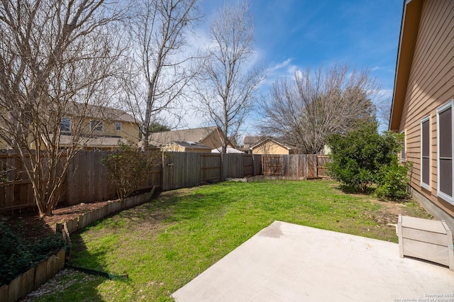 view of yard with a patio area and a fenced backyard