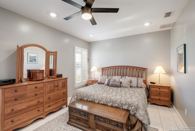 bedroom with light tile patterned floors, visible vents, and recessed lighting