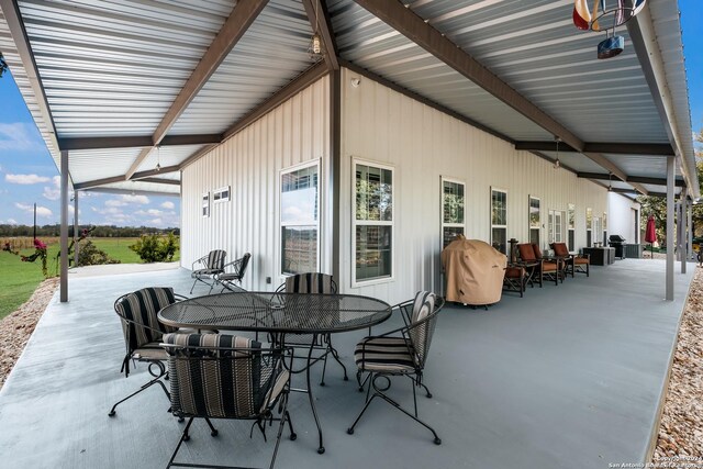 view of patio featuring outdoor dining space and a grill