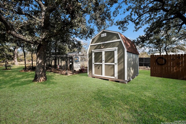 view of shed featuring fence