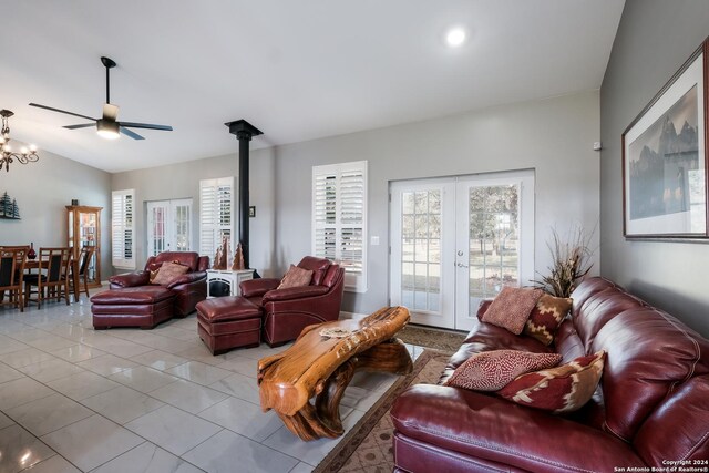 living area featuring ceiling fan, french doors, and light tile patterned flooring