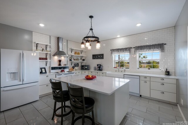 kitchen featuring open shelves, white appliances, white cabinets, backsplash, and wall chimney exhaust hood