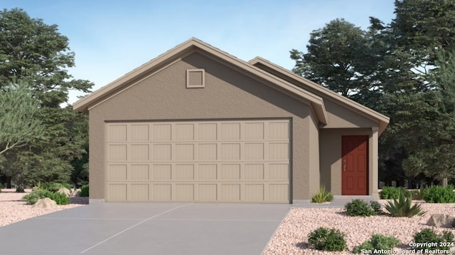 view of front of house featuring an attached garage, an outdoor structure, concrete driveway, and stucco siding