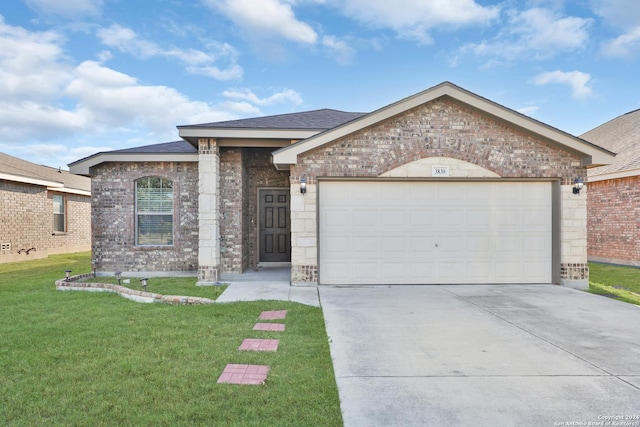 single story home with an attached garage, driveway, a front lawn, and brick siding