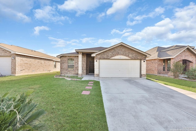 single story home featuring a garage, brick siding, concrete driveway, and a front yard