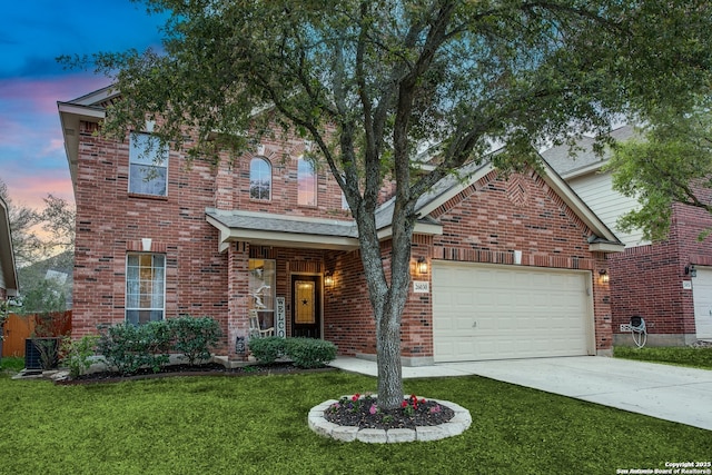 view of front of house featuring concrete driveway, brick siding, a front lawn, and an attached garage