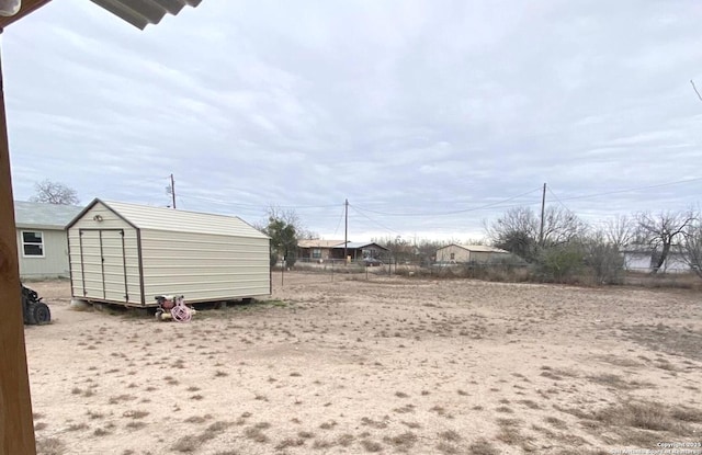 view of yard with a shed and an outdoor structure