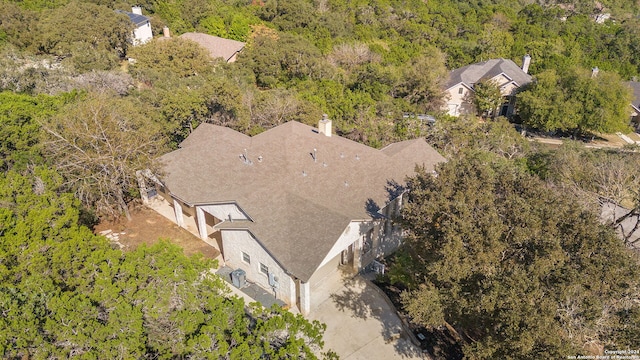 11217 Cave Crk, Helotes, TX 78023 - bird's eye view featuring a wooded view